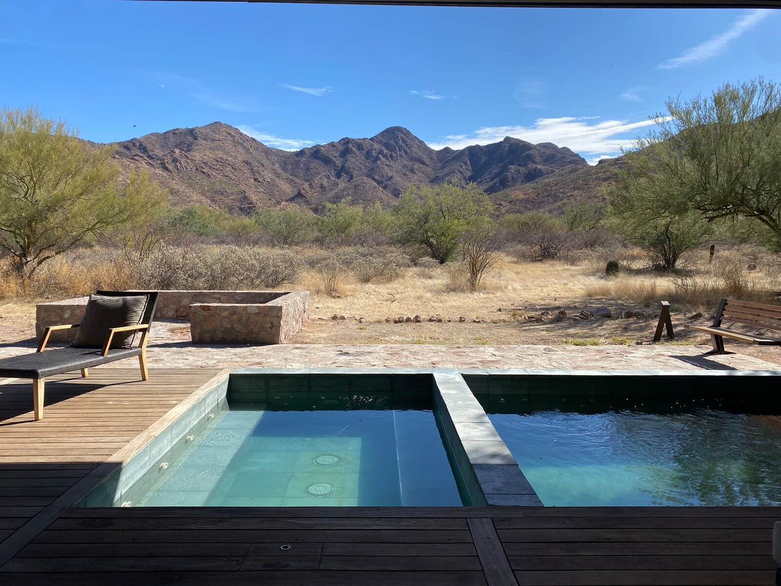 Placeholder: rocky ridgeline in the property's remote country